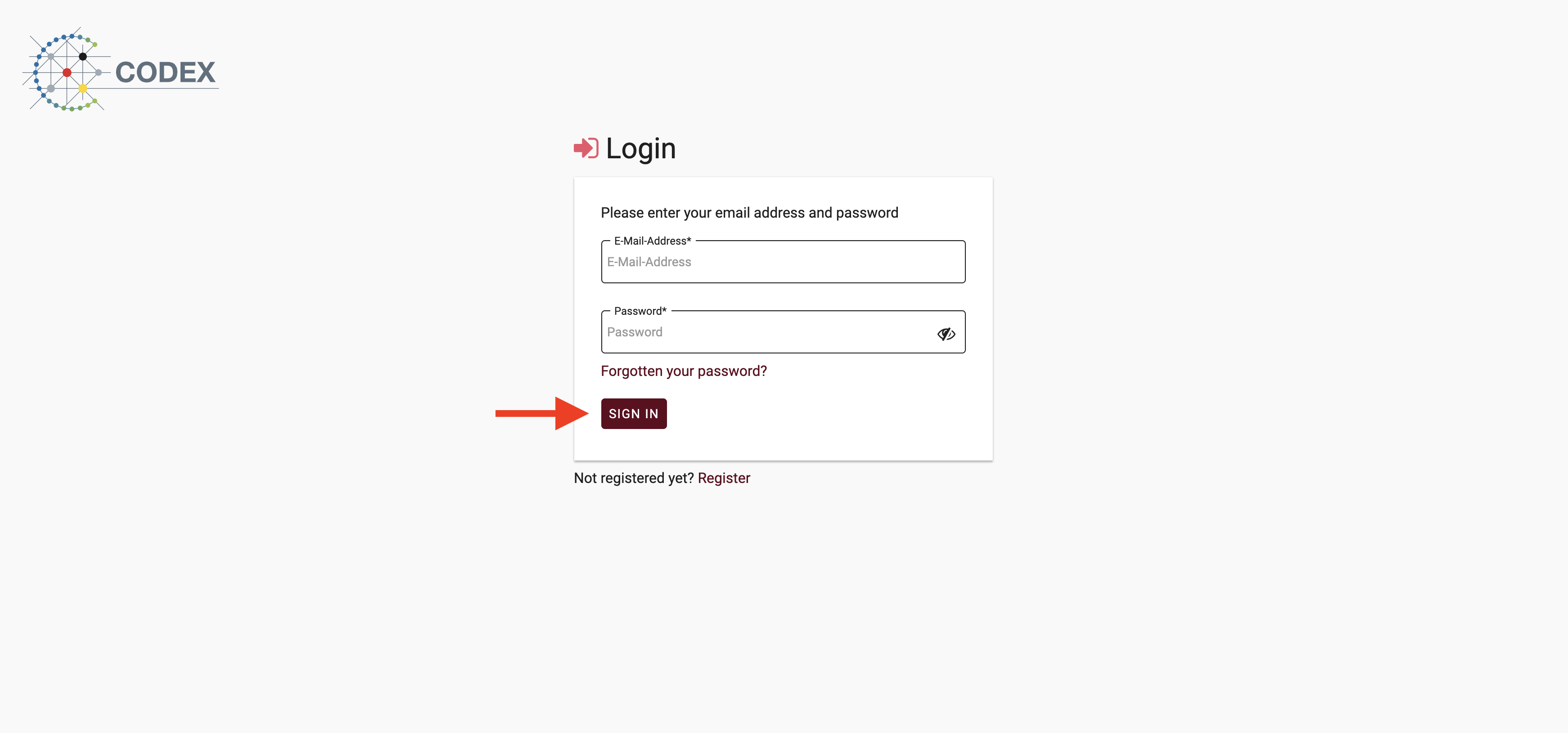 Login page with a red arrow pointing to the registration link